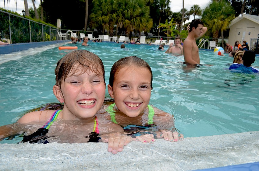 Jessica Dumont and Kaitlyn Harper splash around in the pool.