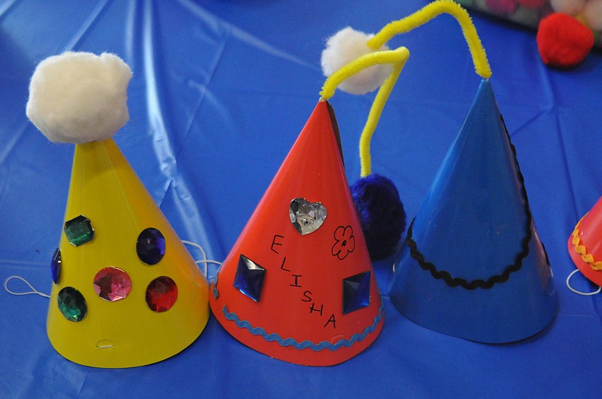 Vacation Bible school students made carnival hats to go with the camp theme, 