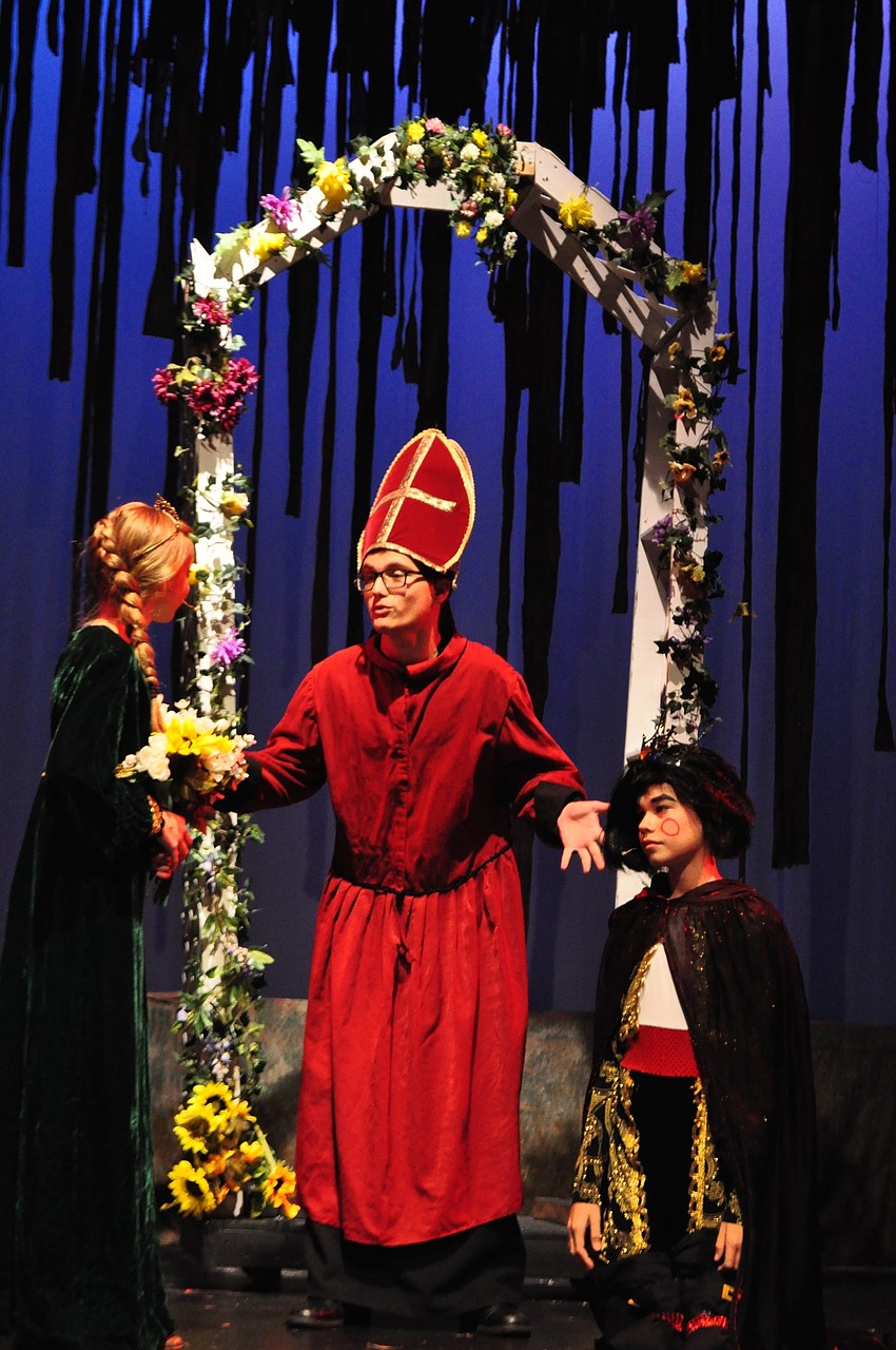 Andrew Stevens, center, weds Princess Fiona (Mary Grace Epps) and Lord Farquaad (Caden Denslow).