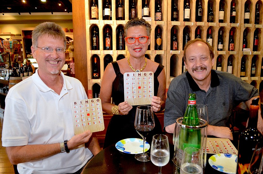 Dr. Fred Smith and his wife, Barb, of 2nd Ann Rose, are geared up for the event, with their friend, Kevin Neurer, wine and bingo boards.