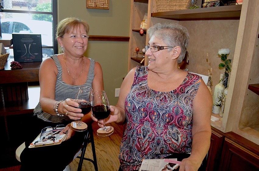 Nichola Adams and Rosemary Pagillo toast to ladies' night.