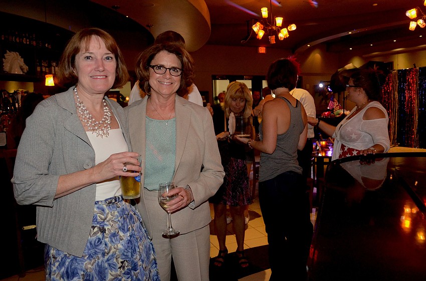Barb Lewis and Chris Yekel enjoy drinks and a night out in the Ranch.