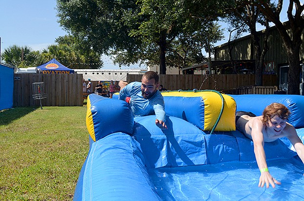 John Widmann tries out the Slip 'n’ Slide at JDub's Brewing Co.
