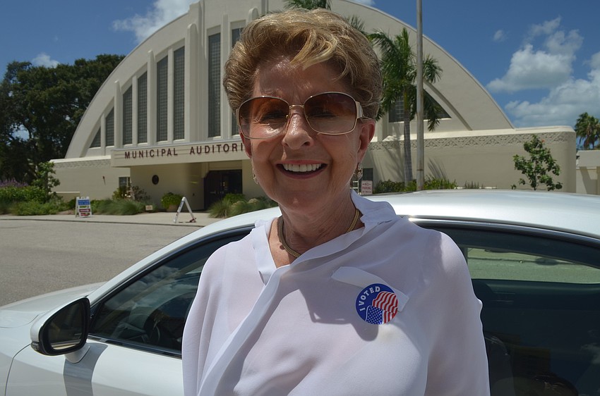 Renee Sheade votes at the Municipal Auditorium.