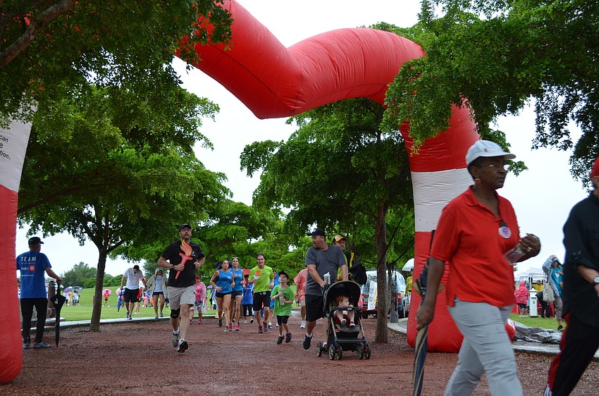 Supporters approach the finish line for the 2014 Heart Walk at Payne Park.