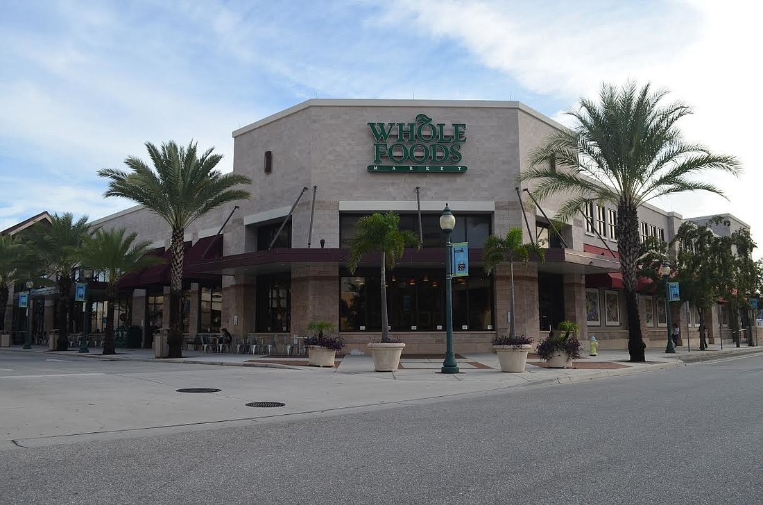 A Daytona Beach investment firm is betting on a bright future for downtown Sarasota with the purchase of Whole Foods Market Centre.