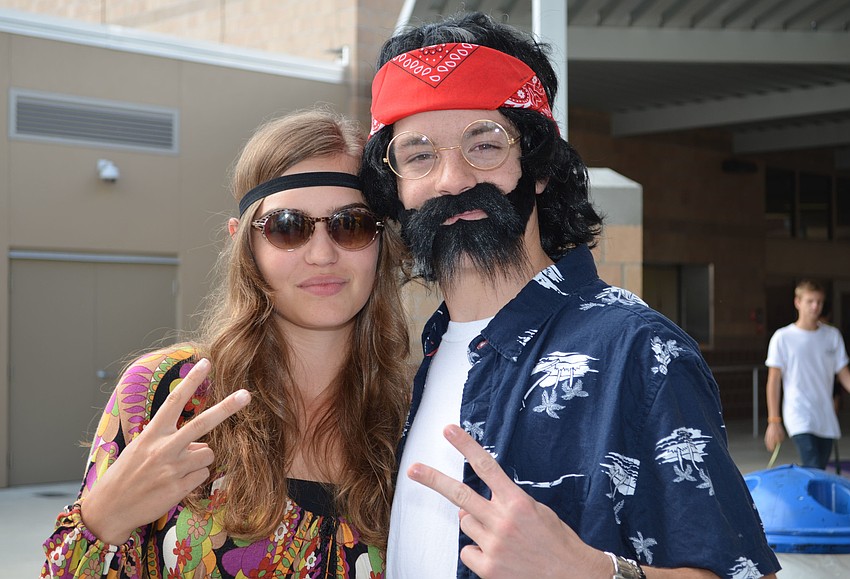 Grace Gerdes dressed as a groovy hippie and Robbie Hodgson dressed as Tommy Chong.