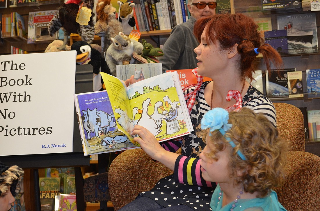 Kate Thomas reads stories to children.