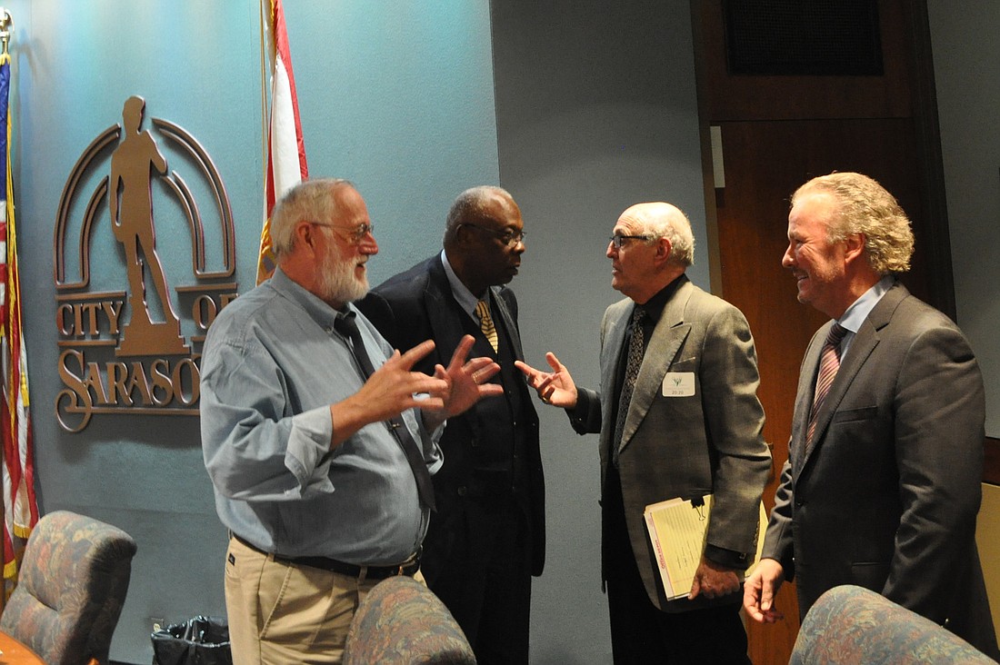 Commissioner Stan Zimmerman, Mayor Willie Shaw, Van Wezel Foundation board member Marty Rappaport and Sarasota Bayfront 20:20 leader Michael Klauber chat following Monday's workshop.