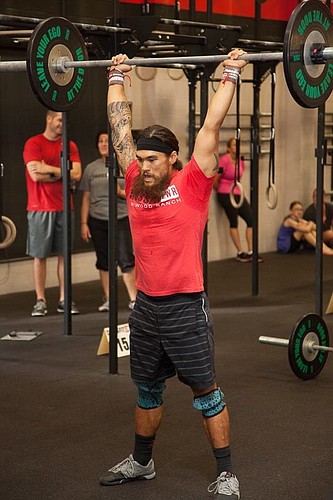 Courtesy photos CrossFit Lakewood Ranch coach Josh Davis completes one of five CrossFit Open workouts, which landed him a spot in the this weekend's regional competition.