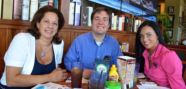 Lisa Hodo, Dan Gladding and Davida McDonald canâ€™t wait for their food to arrive.