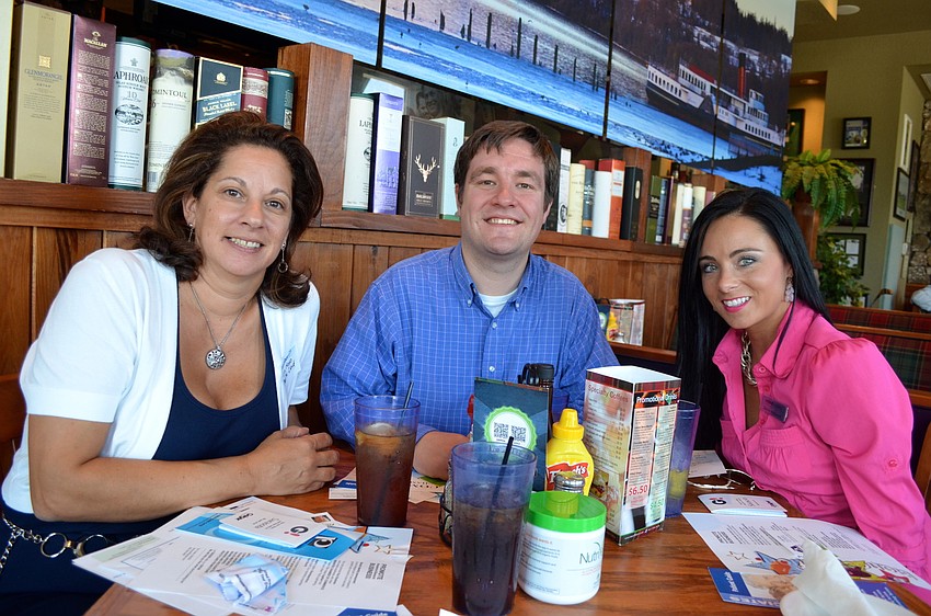 Lisa Hodo, Dan Gladding and Davida McDonald canâ€™t wait for their food to arrive.
