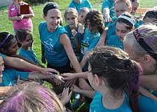 Girls Inc. participants shout a cheer before the run.