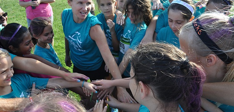 Girls Inc. participants shout a cheer before the run.
