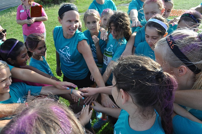 Girls Inc. participants shout a cheer before the run.