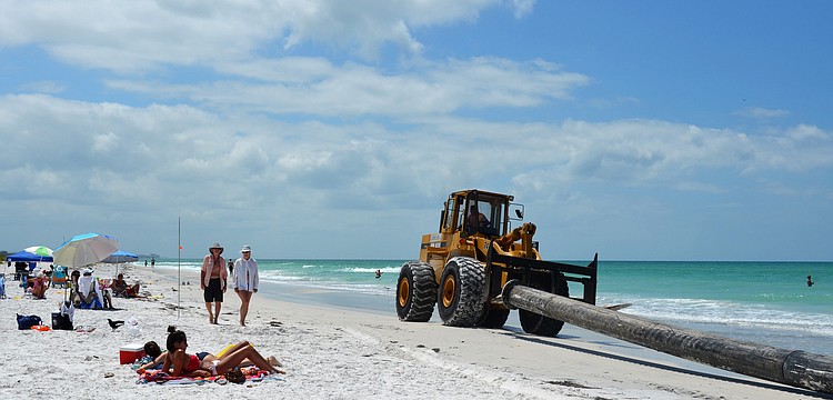 Sand should be flowing from the pipes onto the beach by Wednesday.
