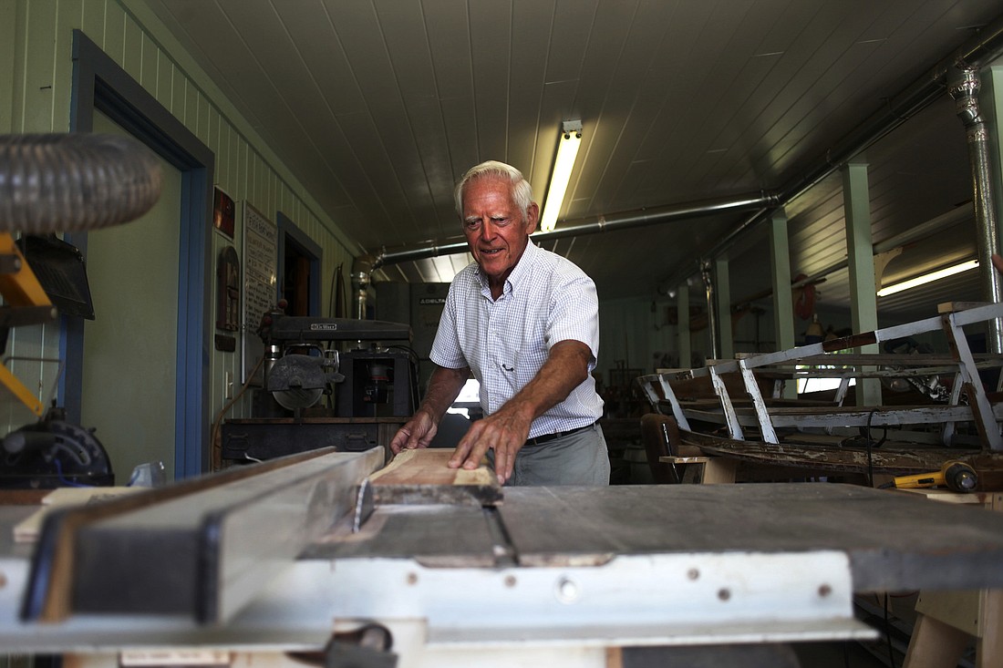 Herman Kruegle prepares to saw wood at FISH Boatworks. Photos by Kelsey Grau