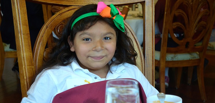 Amy Delangel places her napkin down before eating her soup.