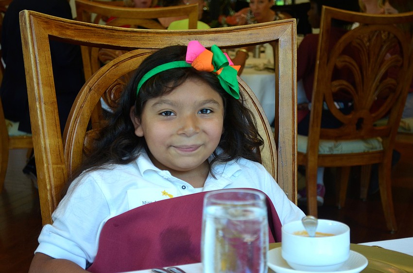 Amy Delangel places her napkin down before eating her soup.