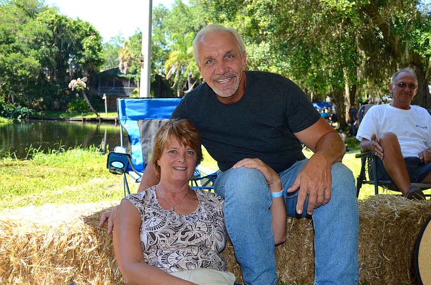 Susan Kent and Jack Zolnierowski enjoy the music from a hay stack.