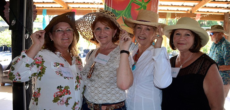 Dolly Ivey, Theresa Bealle, Joanne Quares and Gail Beuile show off their accessories.