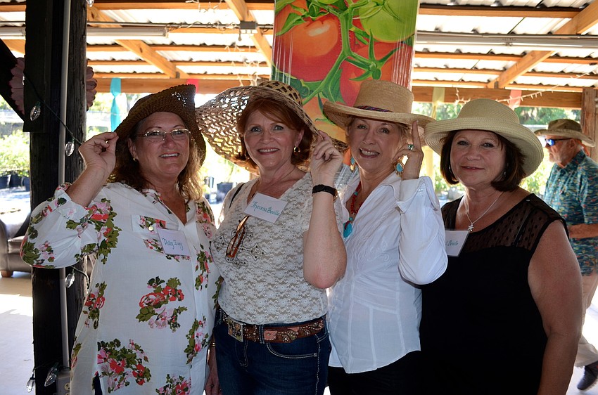 Dolly Ivey, Theresa Bealle, Joanne Quares and Gail Beuile show off their accessories.