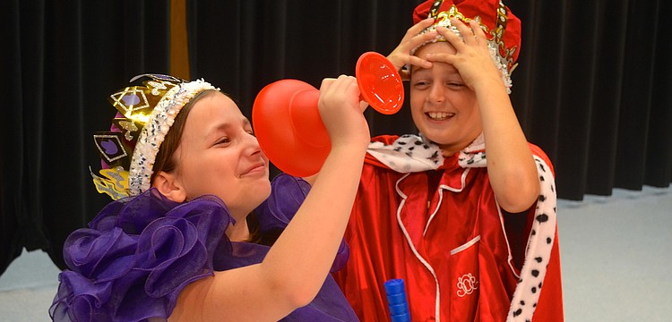 Arianna Pryor as "Queen Gertrude" and Gage Hinds as "King Claudius."