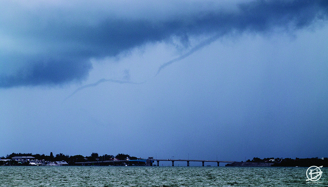 David Frayer submitted this photo of a water spout over New Pass Bridge.