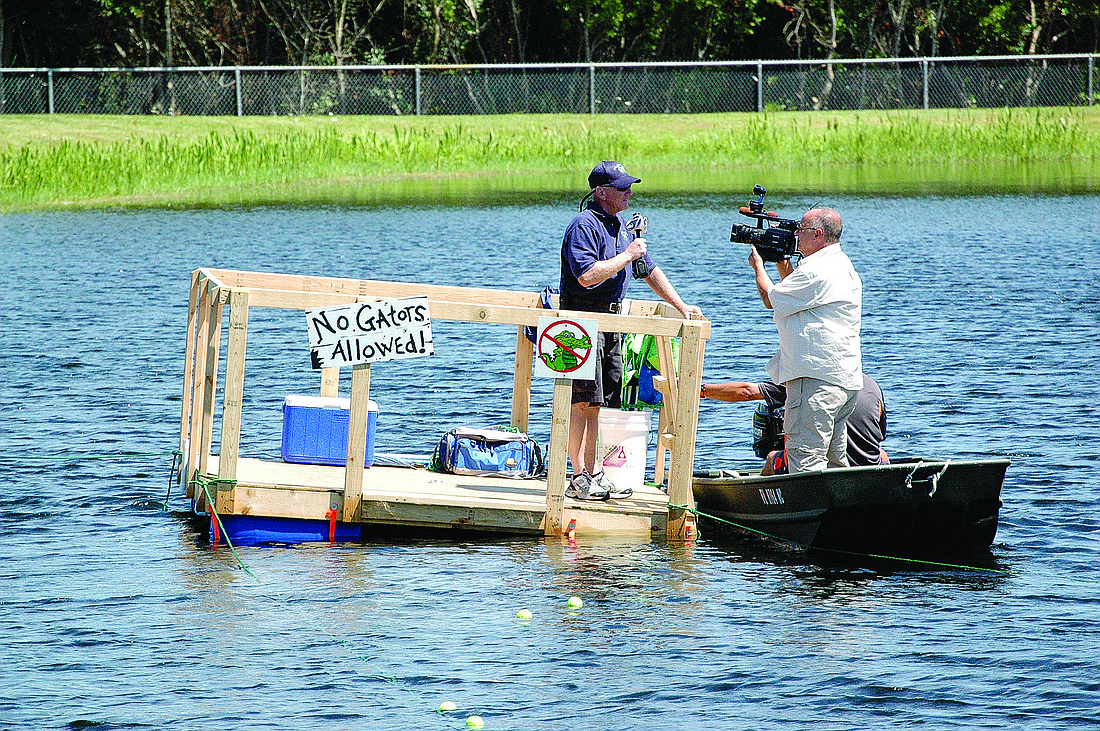A Channel 7 WWSB ABC news reporter interviews Principal Bill Stenger by the raft. Photo by Laurie Rahn