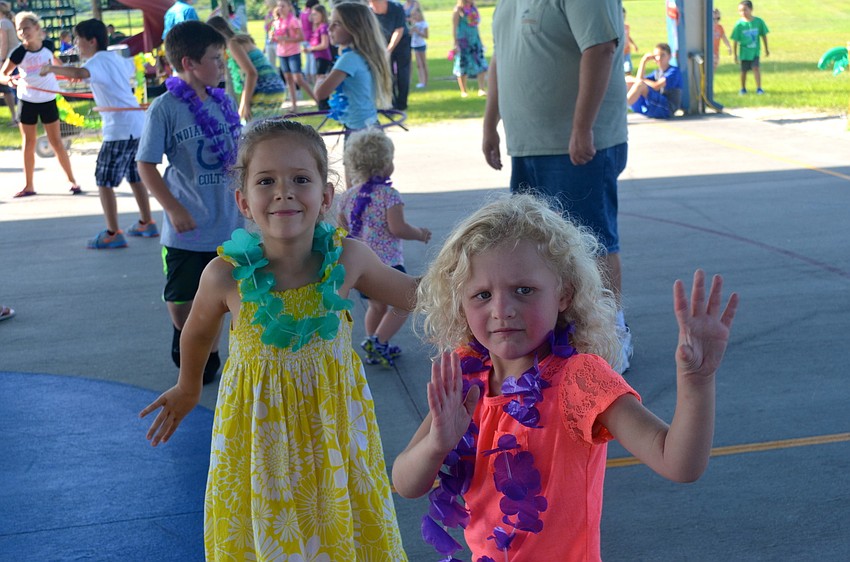Emma Rodman and Savannah Moore sway to the music.