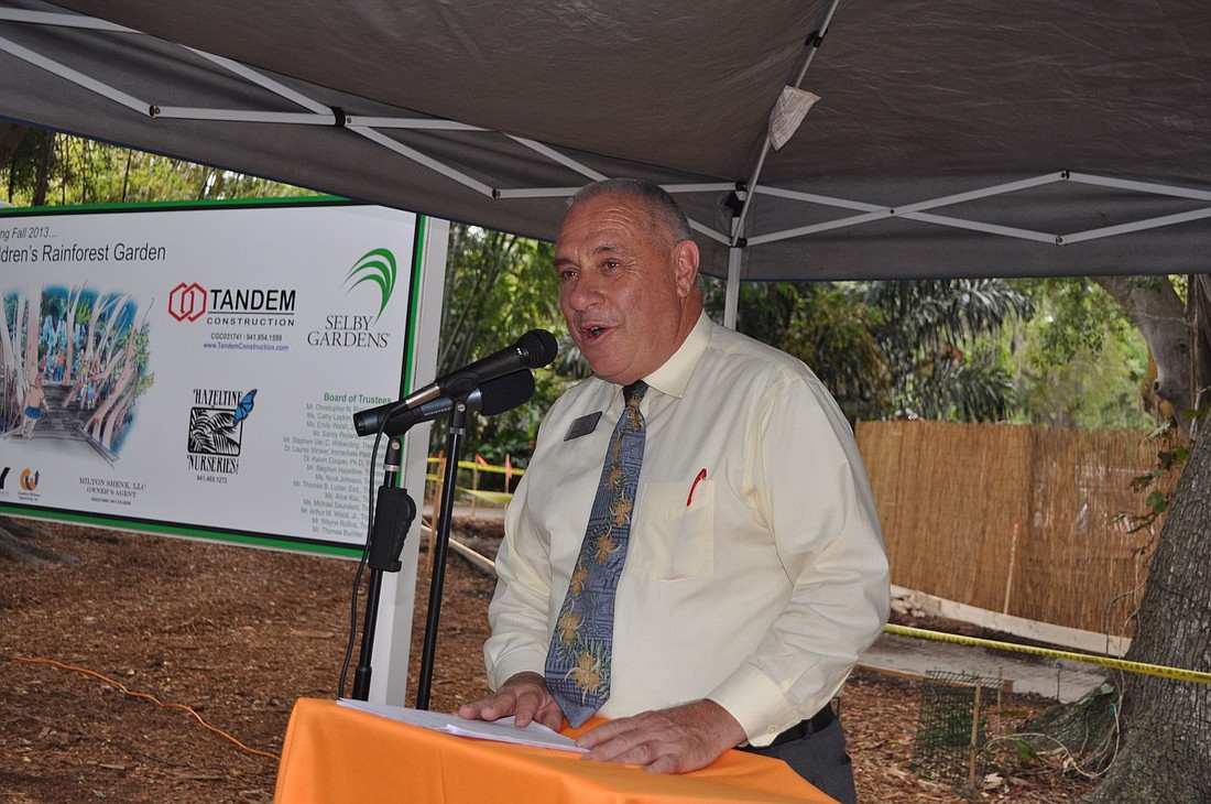 Thomas Buchter speaks at a 2013 event celebrating the construction of the Ann Goldstein Children's Rainforest Garden.