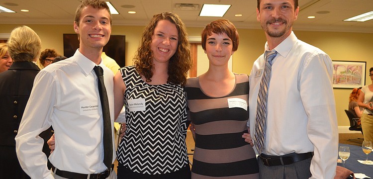Scholarship recipients Hunter Carpenter, Taylor Melendy and Veronica Gammaro with Earl Young