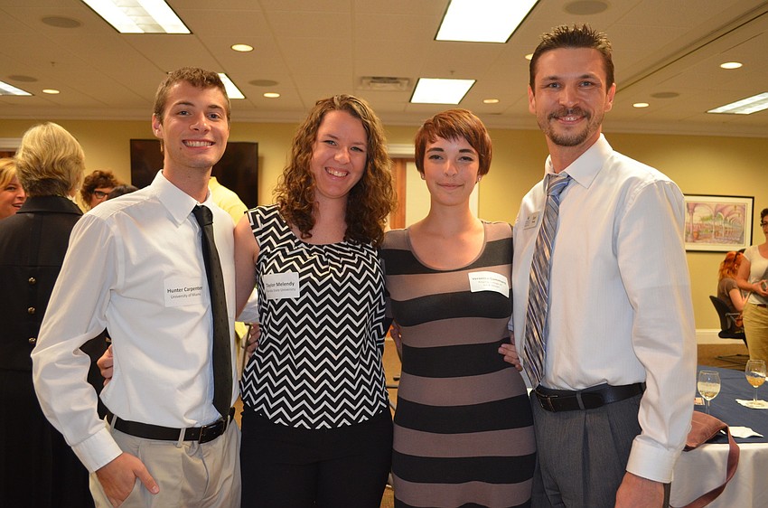 Scholarship recipients Hunter Carpenter, Taylor Melendy and Veronica Gammaro with Earl Young