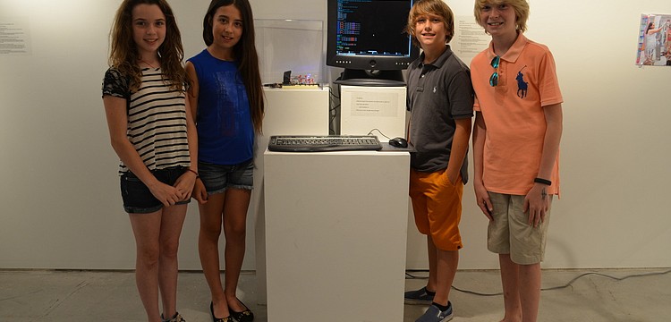 The Out-of-Door Academy students Monet Ramsey, Alexandra Kozel, Phineas Scanlan, William Lahners with the interactive piece they built, "Raspberry Pie"