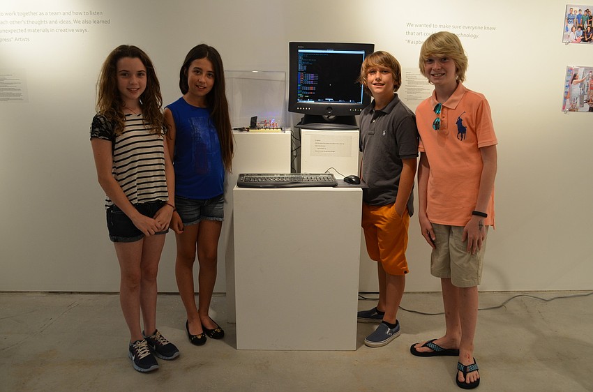 The Out-of-Door Academy students Monet Ramsey, Alexandra Kozel, Phineas Scanlan, William Lahners with the interactive piece they built, 