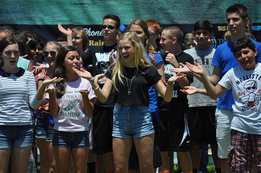 Erin French smiles as she dances to â€œHappyâ€ by Pharrell Williams.