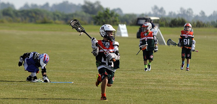 Nine-year-old Isaiah Cohen races down the field toward the goal for the Monsters U9 team.