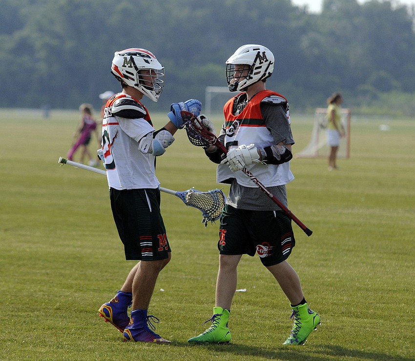 Clark Flessner, left, is congratulated following his goal in the second half versus Inspiration Academy.