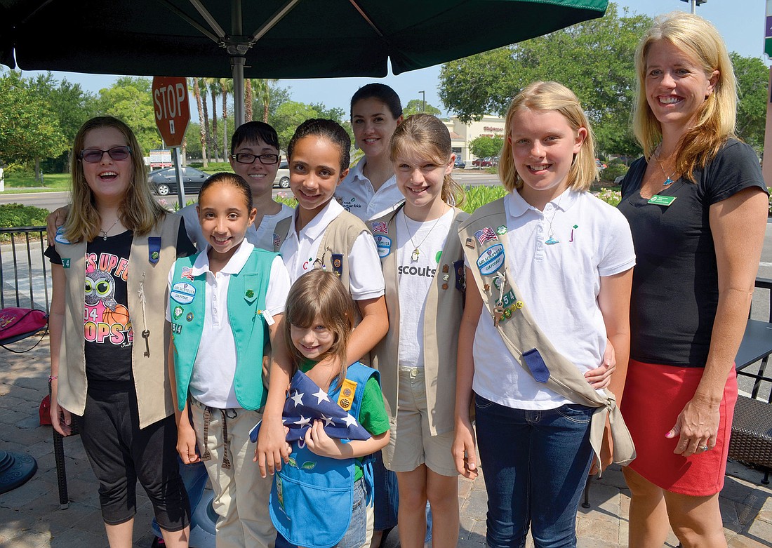 Sheri Potter, right, has been troop leader for Troop 254 for six years. She hopes the experience will help instill a sense of community in the girls.