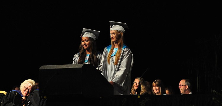 Victoria Najmy and Kayla McNulty jointly give a speech.