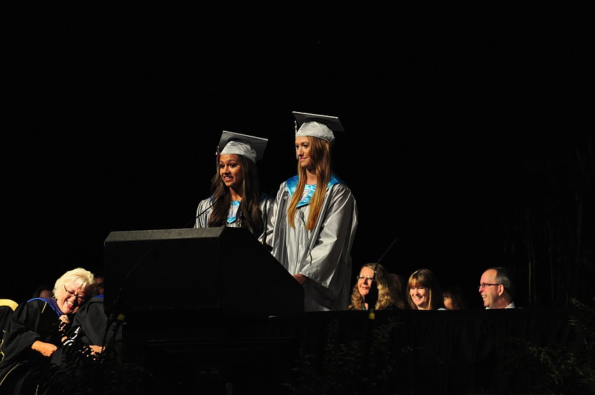 Victoria Najmy and Kayla McNulty jointly give a speech.