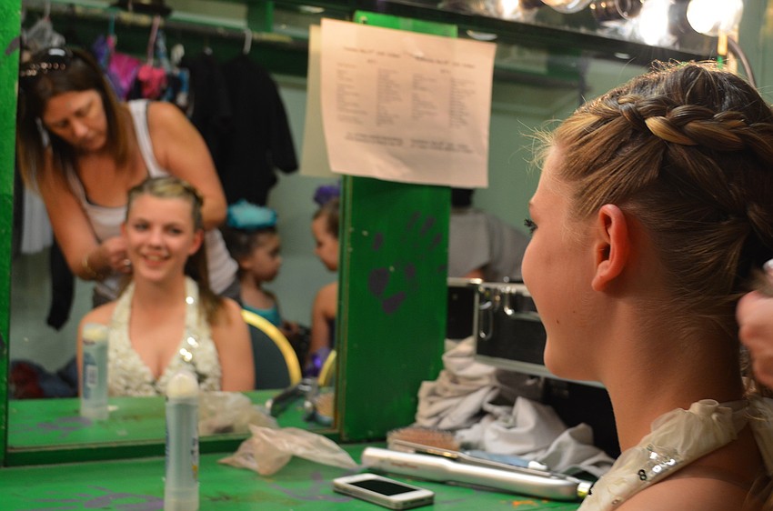 Hope Averill, 12, gets her hair done before she performs a solo dance