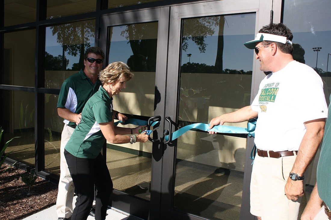 St. StephenÃ¢â‚¬â„¢s Head of School Dr. Jan Pullen cuts the ribbon at the grand opening of the new Falcon Field House.