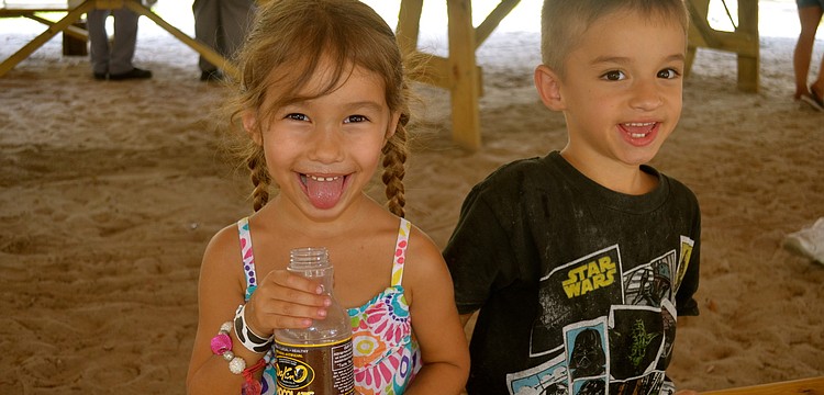 Sage and Rock Esposito enjoy cold chocolate milk.