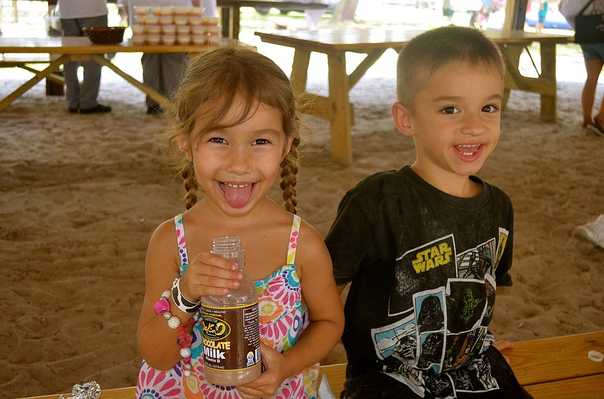 Sage and Rock Esposito enjoy cold chocolate milk.