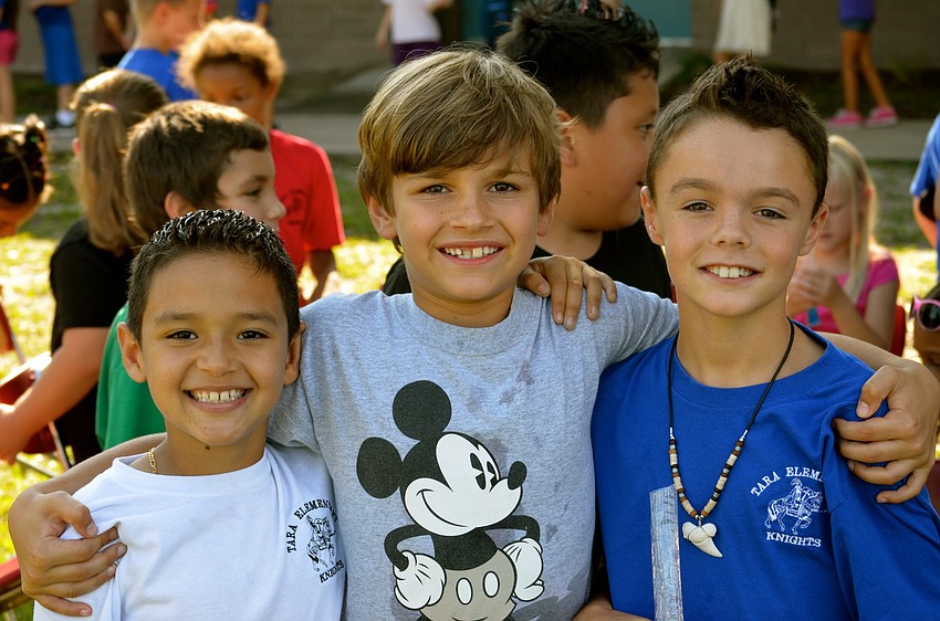 Robert Navarro, Noah White and Cayden West enjoy the game.