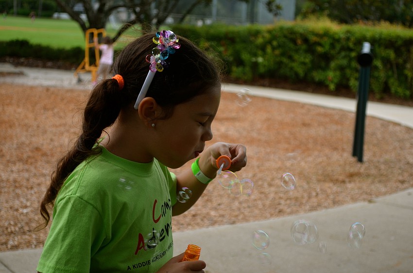 Juliana Misser tries to blow a bubble.