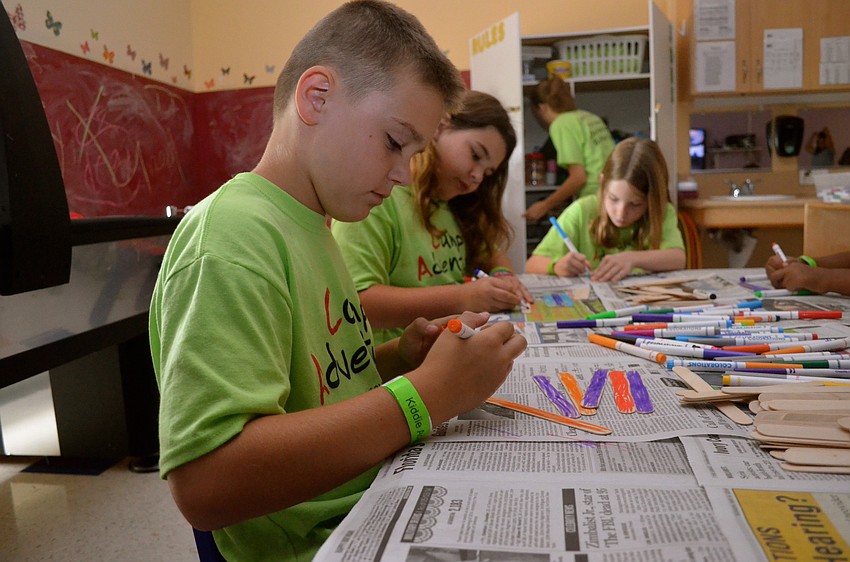 Nine-year-old Ty Fraser creates a gift for his father.