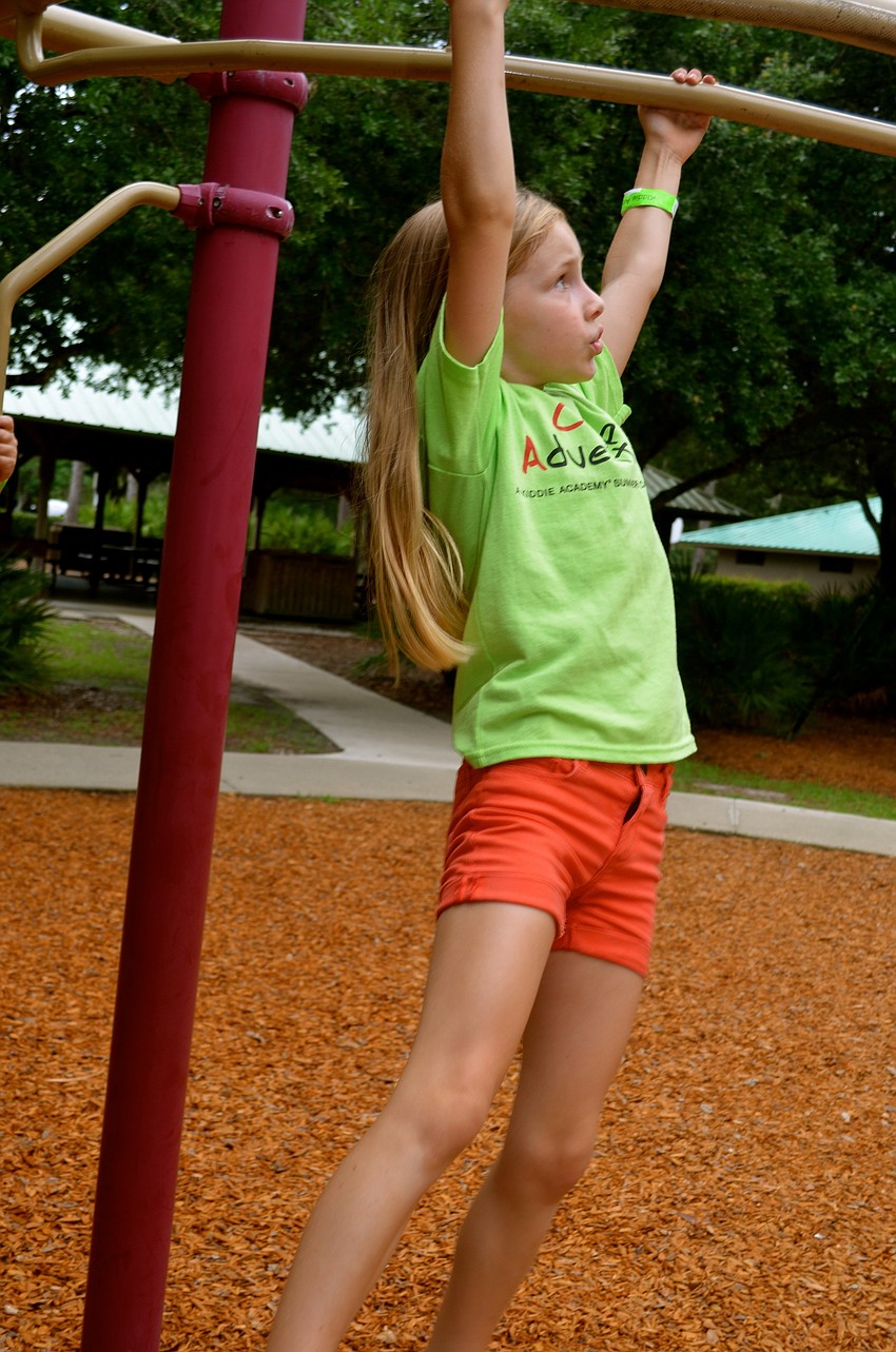Nateline Clark shows off her arm strength.