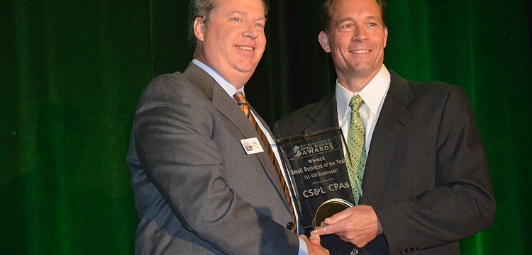 Pat Dorsey presents the Small Business of the Year (51 to 100 Employees) Award to Bob Stanell of CS&L CPAs.